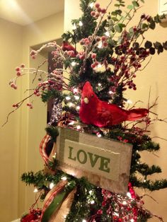 a christmas tree decorated with red, white and green decorations