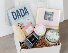 a white box filled with lots of different types of personal care products and books on top of a wooden table