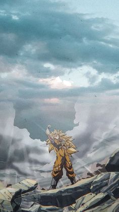 a man standing on top of a pile of rocks next to a giant cloud filled sky