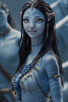 a woman dressed as avatar from avatar is standing in front of two other avatars