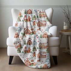 a white chair with a blanket on top of it