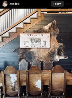 there is a sign that says stores on the wall next to some chairs and stairs