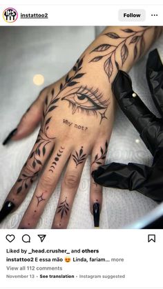 a woman's hand with tattoos on it that says may do? and an eye