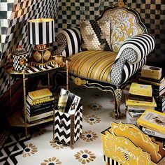 a room with black and white checkered walls, gold accents and striped chairs in the corner