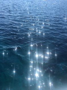 the sun shines brightly on the water as it reflects off the surface in this photo