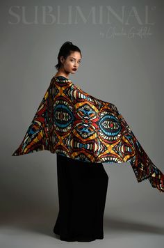 This long and beautiful shawl is printed with an original artist's design and is made from the purest AA grade Mulberry silk, an elegant and incredibly soft fabric that will wrap your neck and body with plenty of boldness and creativity. *Limited Edition* #ByClaudiaGastaldo #artscarf #designerscarves #designerscarf #printedscarves #printedshawl #flamboyantclothing #dramaticfashion #puresilkscarves #artistscarves #artistscarf #boldclothing #boldclothes #colorfuloutfits Designer Shawl, Silk Stoles, Fancy Fashion, Ethnic Chic, Art Scarves, Designer Scarves, Shawl Wrap, African Inspired, Eclectic Style