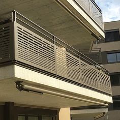 an apartment building with balcony and balconies