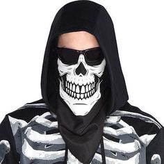 a man wearing a skeleton mask with sunglasses on his face and scarf around his neck