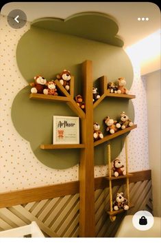 there is a tree shelf with stuffed animals on it