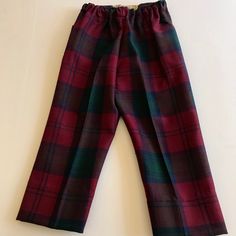 Vintage Hector Russell Kiltmaker Plaid Tartan Pants . A beautiful Made in Scotland 100 per cent pure wool Tartan pants . The colors are rich burgundy with greens and navy blue . The pants have elastic waistband in front with back pocket . Tagged size Four these may have been shortened or custom hemmed . A good 2 inches of hem available . Measure waist to cuff 20.5 inches , inseam 13 inches , waist 10 inches . I do have a matching Kilt skirt from same estate sale purchase listed . Pink Doll Dress, Checkered Trousers, Measure Waist, Tartan Pants, Royal Stewart Tartan, Kilt Skirt, Baby Coat, Rich Burgundy, Vintage Trousers