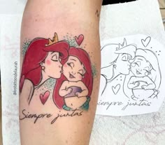 the little mermaid tattoo is on someone's leg