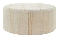 a white and beige ottoman with stripes on it