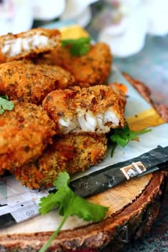 some fried food on a plate with a knife