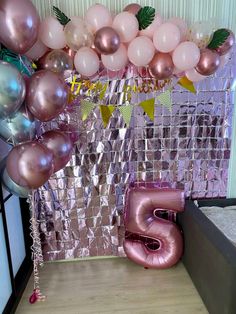 balloons and streamers in the shape of letters are on display