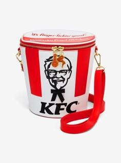 Pack up for your next fried chicken run with this KFC-inspired crossbody! Shaped like a chicken bucket  the front of this bag includes a ribbon detail as the colonel's tie. With embroidered writing on the lid  this bag includes drumstick and wing metal zipper pulls and a removable crossbody strap  perfect for storing your foodie essentials.A BoxLunch Exclusive!PolyurethaneApprox. 5 34" W x 7 14" H x 5 34" DImported Chicken Bucket, Unusual Handbags, Funky Purses, Kfc Chicken, Chicken Run, Cartoon Cartoon, Loungefly Bag, Unique Purses, Weird Things