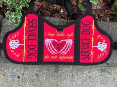 a red and black bag with words on it