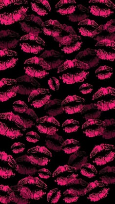 a black and pink background with lots of lipstick imprints on the bottom of it