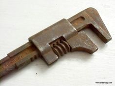 an old wrench that has been used as a tool