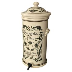 an old fashioned ceramic canister with the words berchgld - filler on it