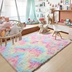 a child's bedroom decorated in pastel colors