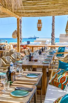 an outdoor dining area with tables and chairs