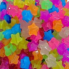 a pile of colorful gummy bears sitting next to each other