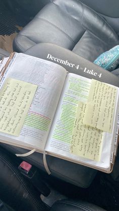 an open book sitting on top of a car seat