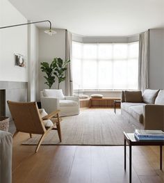 a living room filled with furniture and a fire place