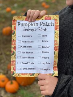 a person holding up a pumpkin patch scavenger plan