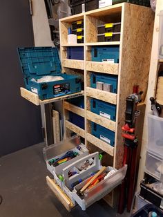 the shelves are filled with tools and other items in storage containers, including pencils