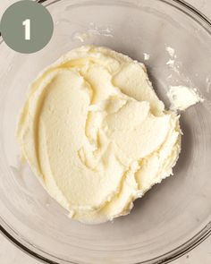 a bowl filled with whipped cream on top of a table