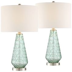 two green glass table lamps with white shades