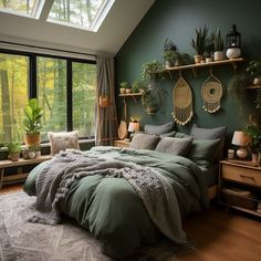 a bedroom with green walls and lots of plants in the window sill above the bed