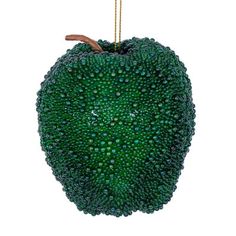 an apple shaped ornament hanging from a chain