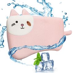 a pink cat purse with ice cubes and water splashing on the ground next to it