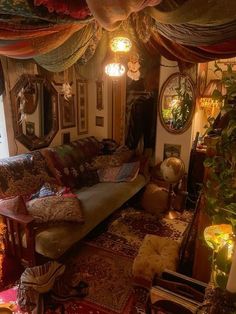 a living room filled with furniture and lots of curtains on the windows sill above