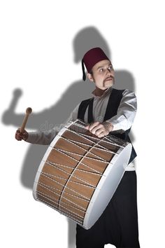 a man with a drum and mallet in his hand royalty images, stock photos