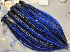 Synthetic hair dreads. They look as close as possible to natural dreadlocks. Description and features: - colors  black, black-blue ombre, black-dark blue ombre, bright blue, white Hand Made blend shades of blue bandage beads shells, duck as a gift - length: 55-60 cm (21,6-23,6 inches) - you can choose DE or SE style in "Number of Dreads" - some dreads are wrapped with yarn  - you'll recieve FREE random beads  For full head you need 50 DE dreads in this sctructure, if you have shaved sides and back 30-40 DE (40 DE if you want to have big dreads volume). Only shaved sides - 40 DE.  Please note! Due to monitor differences, actual colors may vary slightly from what appears online. If you want to have different colors, lengths, curly dreads, dreas with clips or you have other wishes regarding t Black To Blue Ombre, Hair Dreads, Natural Dreadlocks, Fishtail Braids, White Hand, Fish Tail Braid, Blue Ombre