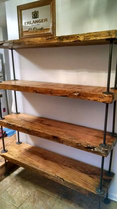 three wooden shelves sitting next to each other