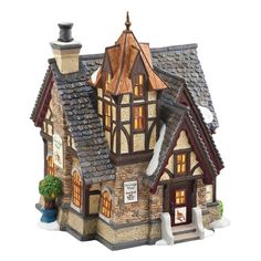 a small house with a clock on the top of it's roof and windows