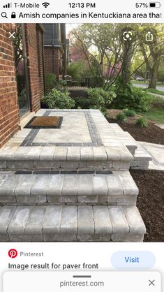 an outdoor patio with steps leading up to it