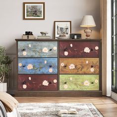 a dresser with flowers painted on it