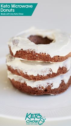 three donuts with white frosting stacked on top of each other