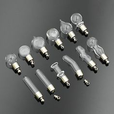 several different types of light bulbs on a black surface with one bulb turned upside down