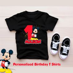 a mickey mouse birthday shirt with the number one on it and two shoes next to it