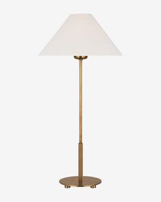 a brass table lamp with a white shade on the base and a gold plated metal base