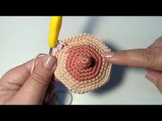 someone is crocheting an object with yarn