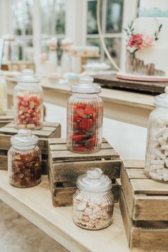 several jars filled with different types of food