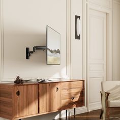 a room with a wooden cabinet and mirror on the wall