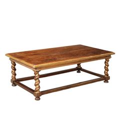 an old coffee table with wooden legs and a wood top on a white background,